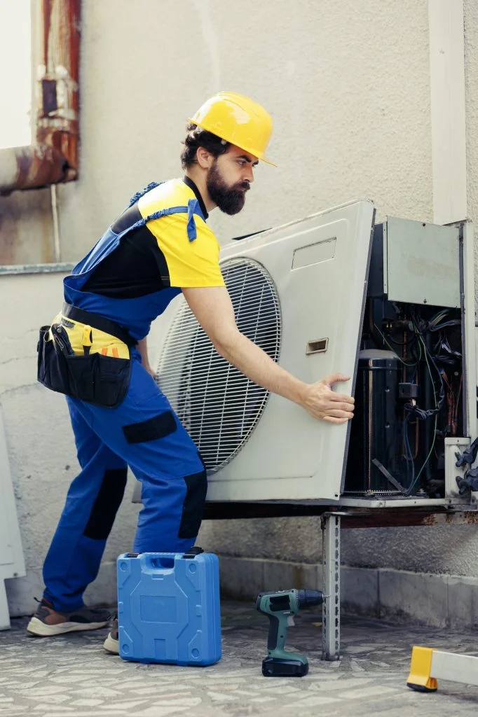 Expert working on air conditioner