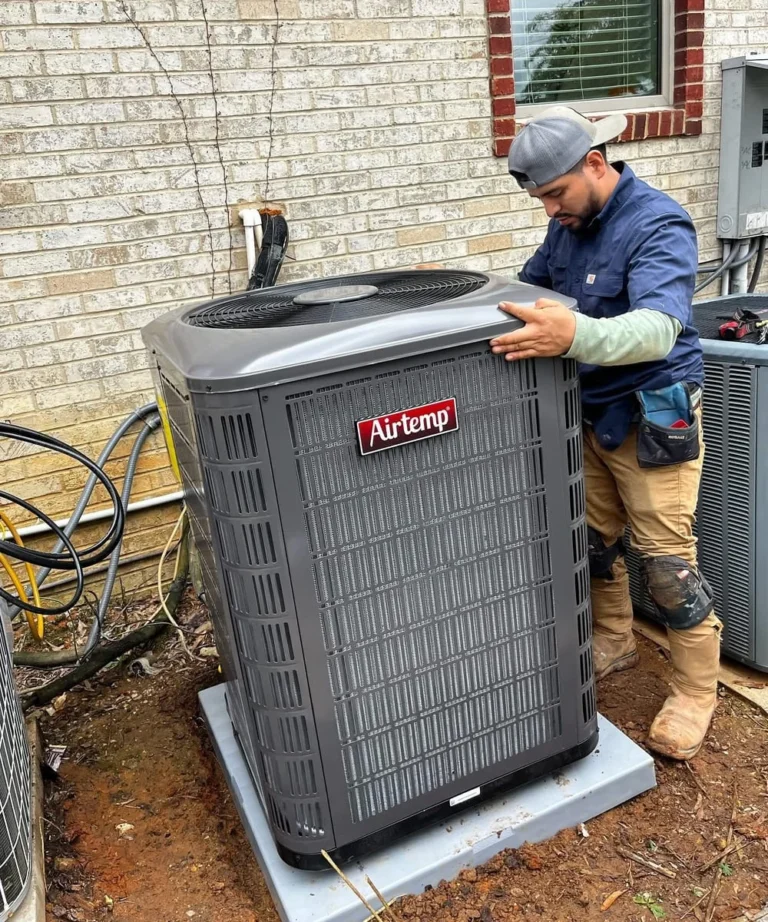 Cool Breeze technician servicing an outdoor AC condenser